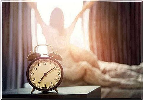 alarm clock with woman stretching