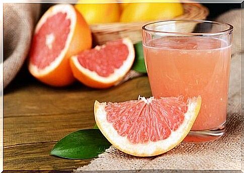 Grapefruit and glass of grapefruit juice