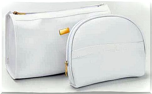 Two white toiletry bags