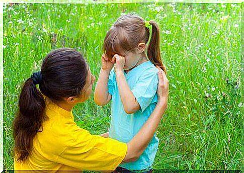 Mother comforts daughter