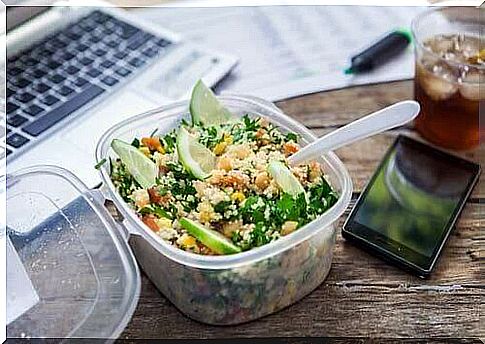 A salad in a bowl on a desk