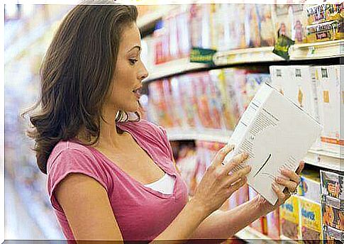 A woman reads the label in a store