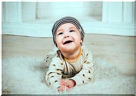 A baby crawling on the carpet