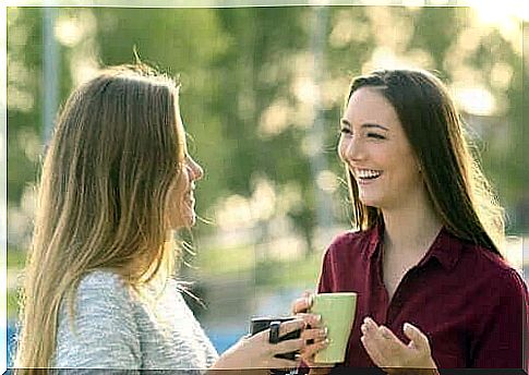 Friends drink a cup of coffee