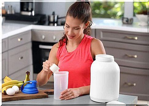 Woman makes protein shake