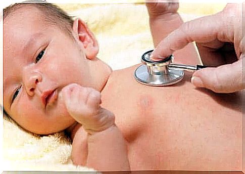 A doctor examining a newborn baby