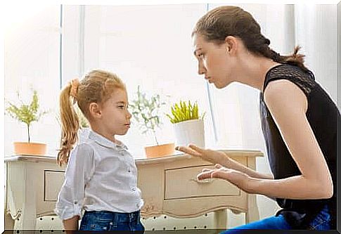 Mother explains something to daughter