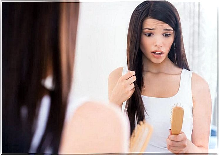 woman startled by hair on her brush