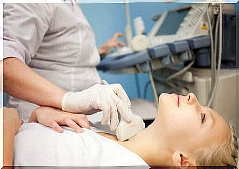 A woman getting a thyroid ultrasound