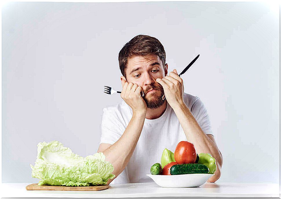 Man looks down at vegetables