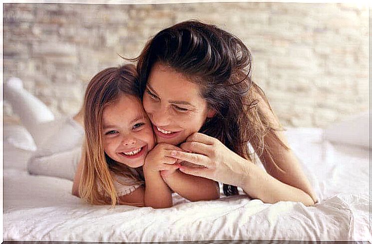 Influence of childhood: hugging mother and daughter